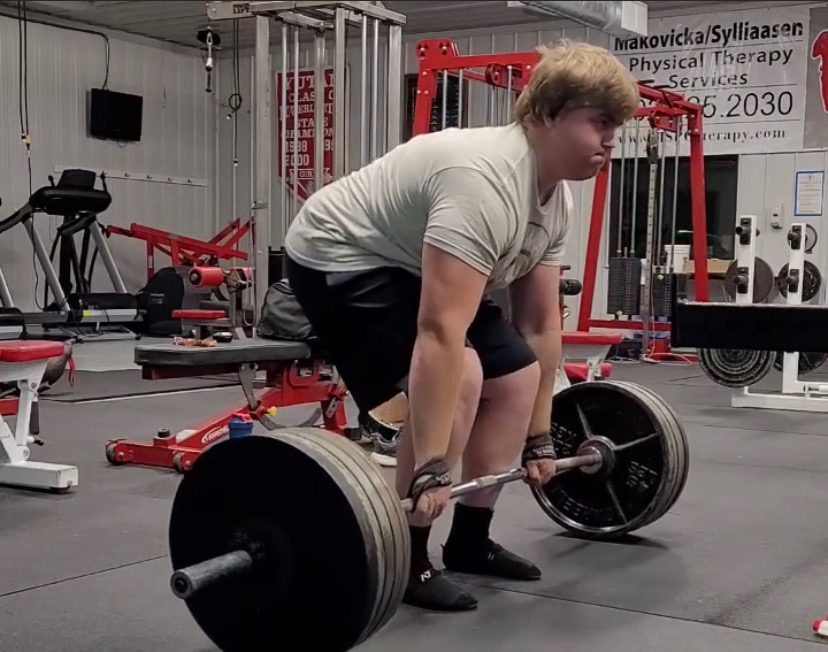 Junior Will Peterson attempts a 500 pound deadlift. Peterson holds school records in squat and bench press.