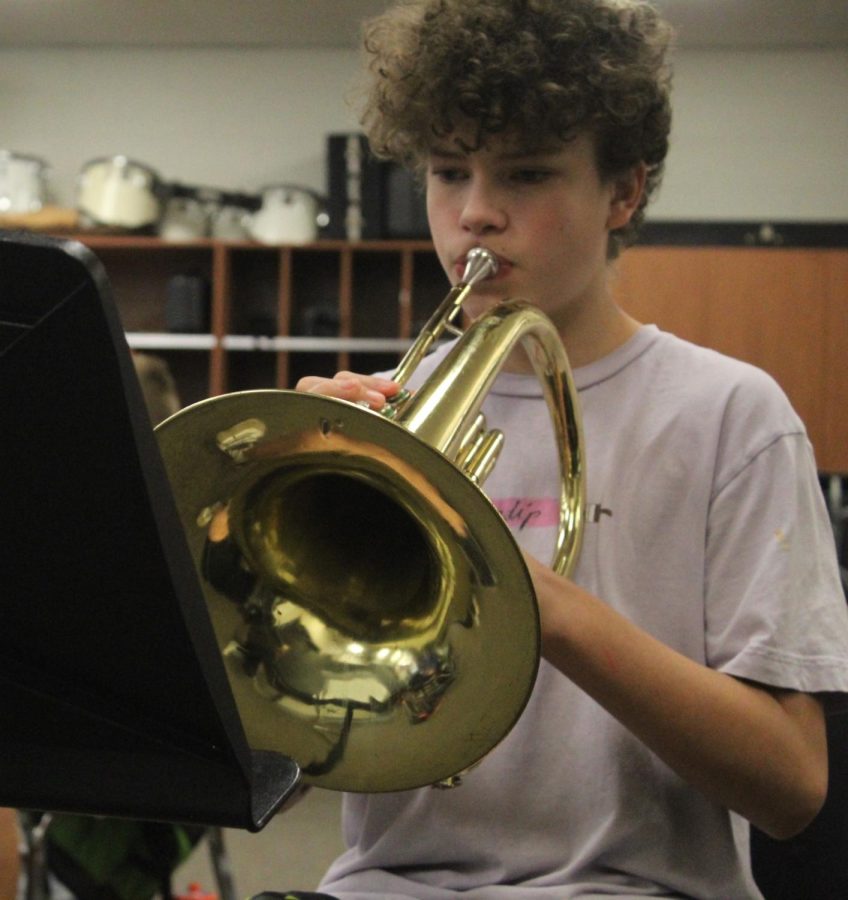 Eighth-grader Levi Eggers practices his mellophone.  All junior high students are required to take either band or choir.