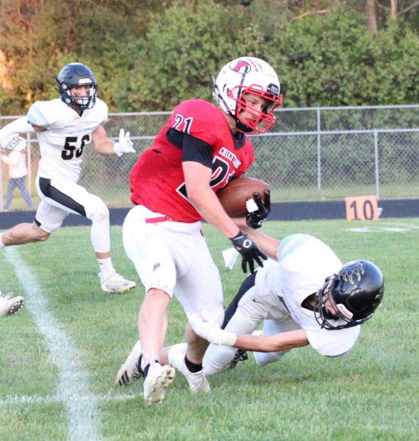 Senior Ethan Christensen avoids the tackle on his way to the endzone. Christensen has over 800 rushing yards this season.