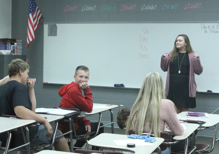 Smith interacts with Spanish 1 students Caleb Cantrell, Drew Krajicek, and Jade Lewis as they participate in a game.  Smith teaches four levels of Spanish.