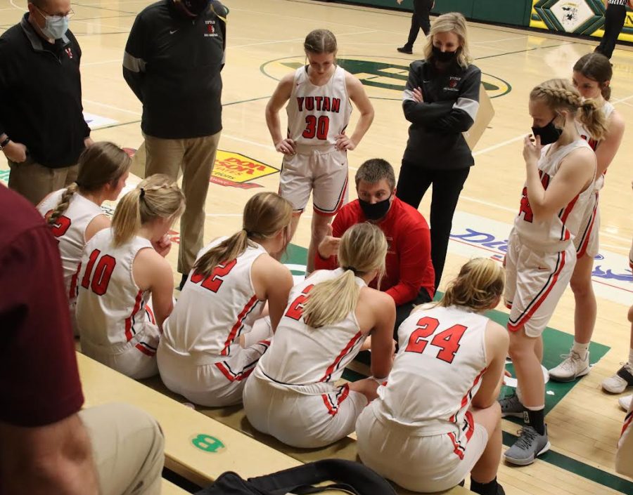 Girls basketball coach Clay Carlton shows the team their plan for the final 2021 subdistrict game.  With many returning players, the Chieftains are hoping to extend their season this year. 