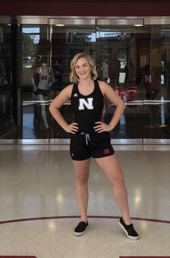 Emma Lloyd poses infront of camera in her Nebraska track jersey. Lloyd dream college was University of Nebraska-Lincoln. Even though there were so many other schools with good offers, I just could not turn down Nebraska, Lloyd said.