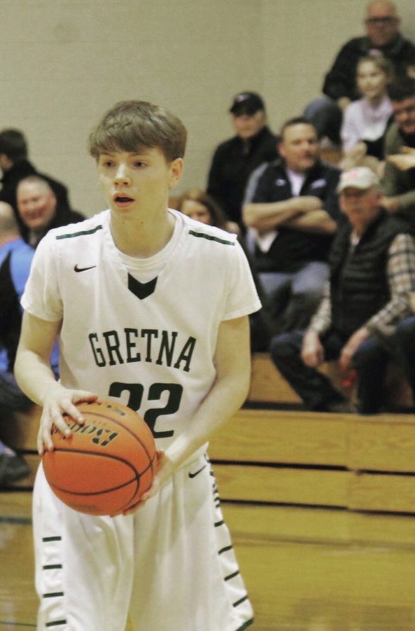 Senior Ben Denly plays in a basketball game at Gretna High School last season. Denly will finish his basketball career this year at Yutan. 