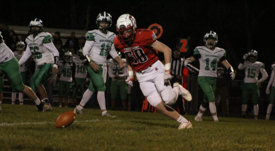 Senior Beau Heuertz runs to retrieve the football after a Wolverine fumble.  The Chieftains scored a few plays later.