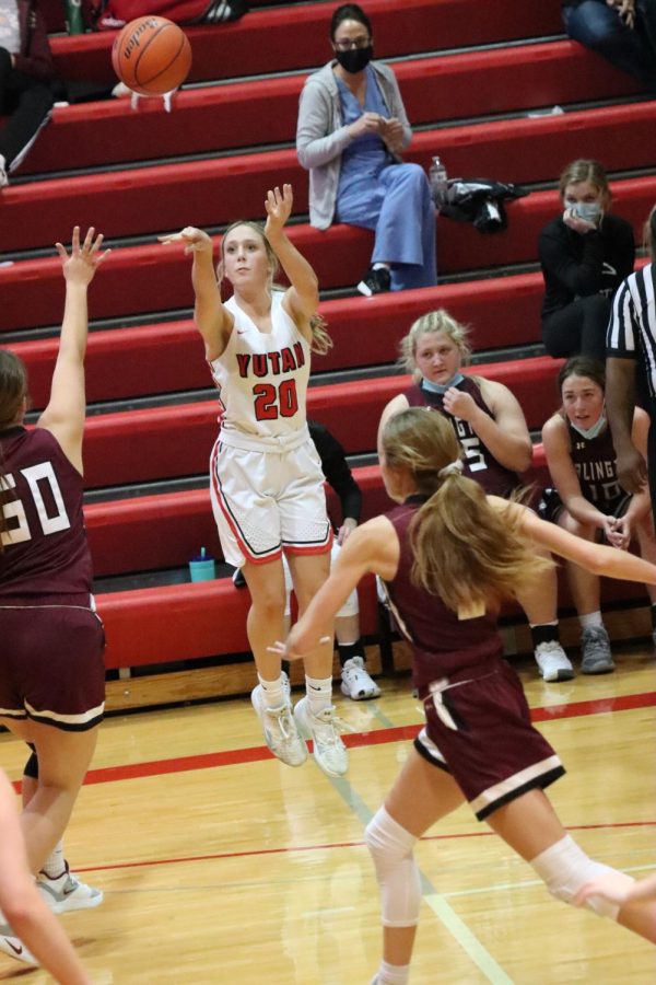 Junior Laycee Josoff shoots the ball from the three point line against Arlington last year. This will be Josoffs third year playing basketball.