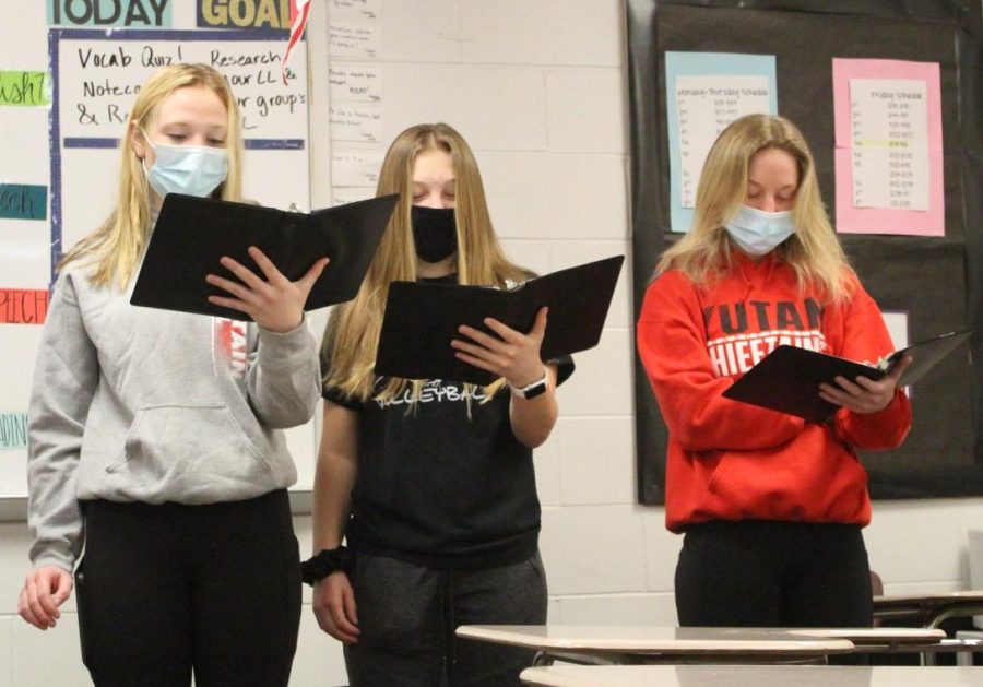 Sophomores Ellie Lloyd, Bella Tederman, and Haley Kube practice their OID. The group practiced many times during lunch.