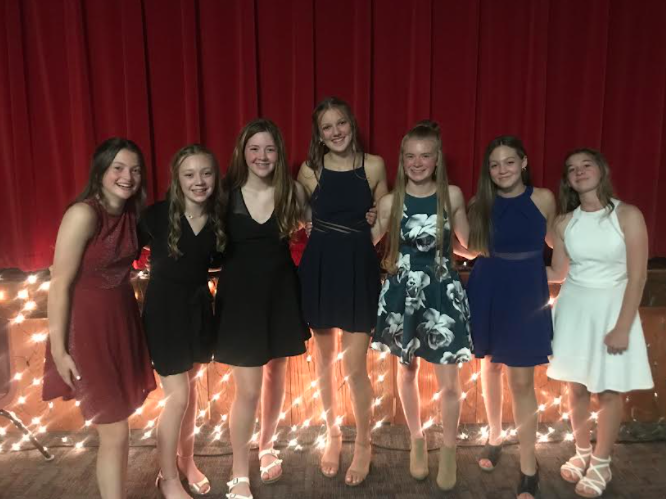 Eighth+graders+Jenna+Benjamin%2C+Kylie+Krajicek%2C+Madison+Wilson%2C+Mylee+Tichota%2C+Delaney+Shield%2C+Nicole+Wacker+and+Anna+Rupp+pose+for+a+group+picture+at+the+dance.+The+junior+high+dance+was+on+October+23.++