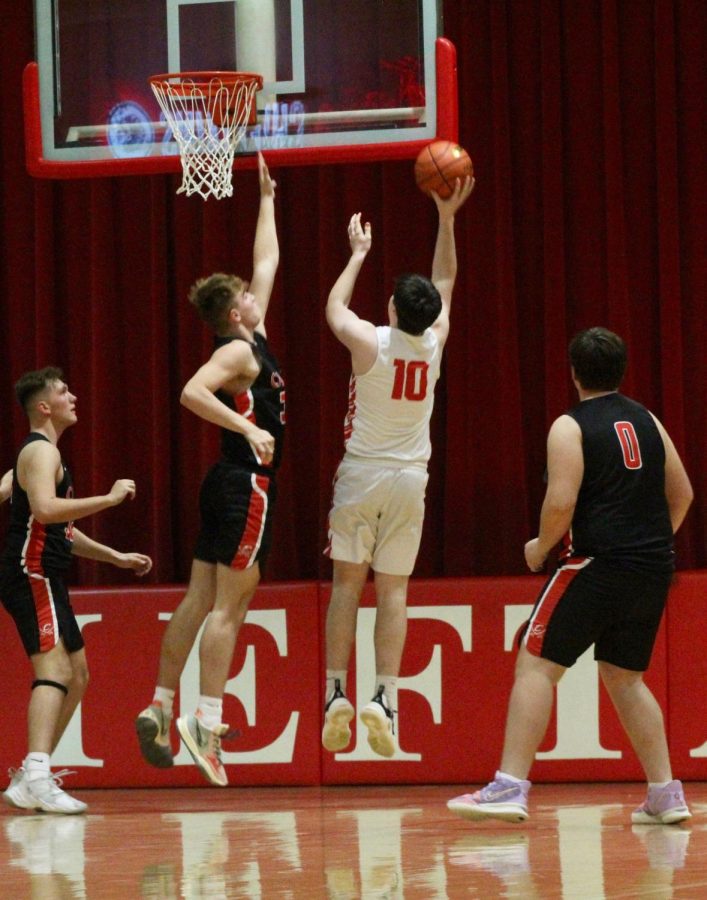Junior Drake Trent goes up for a shot from the block during the West Point-Beemer game. Trent was the six man off the bench during the jamboree.