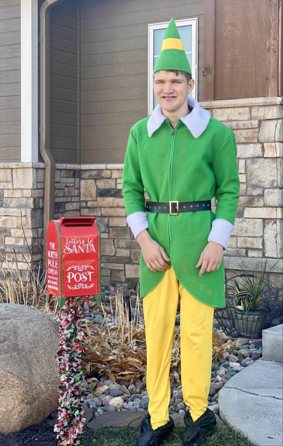 Sophomore Oliver Egr shows off the mail box he set up for neighborhood kids to drop off letters to Santa.  Besides collecting letters, Egr has spread Christmas cheer by raising money to buy presents for kids in need.  