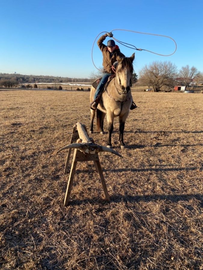 Seventh grader Tucker Barta throws his rope at the roping dummy. Barta plans to take his roping skills further than high school.