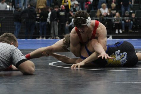 Senior Josh Jessen wrestles his St. Paul opponent at the state wrestling duals. Jessen ended his season with a 43-8 record. 