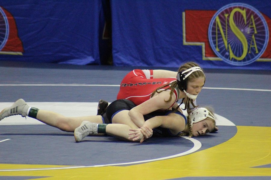 Freshman Aubrie Pehrson wrestles her Lakeview opponent at the state wrestling tournament. Pehrson went undefeated throughout the 2022 wrestling season. 