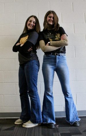 Freshmen Loganne Barta and Libby Winn pose for the camera in their favorite throwback outfits. The two girls enjoy wearing styles from multiple past decades.