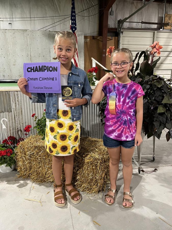 Sisters Ella and Harper Eikmeier pose with their awards for their fashion review projects. The Eikmeier girls took part in multiple 4-H events. 