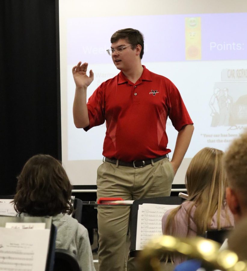 Band instructor Hunter Holoubek gives the junior high students some instructions before they begin playing.  Holoubek directs the high school, junior high, 6th grade and 5th grade bands.