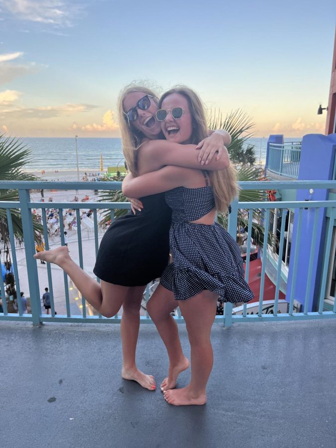 Senior Shaylynn Campbell and junior Maycee Hays pose for the camera while watching the sunset. Campbell and Hays went to Disney World while in Florida.