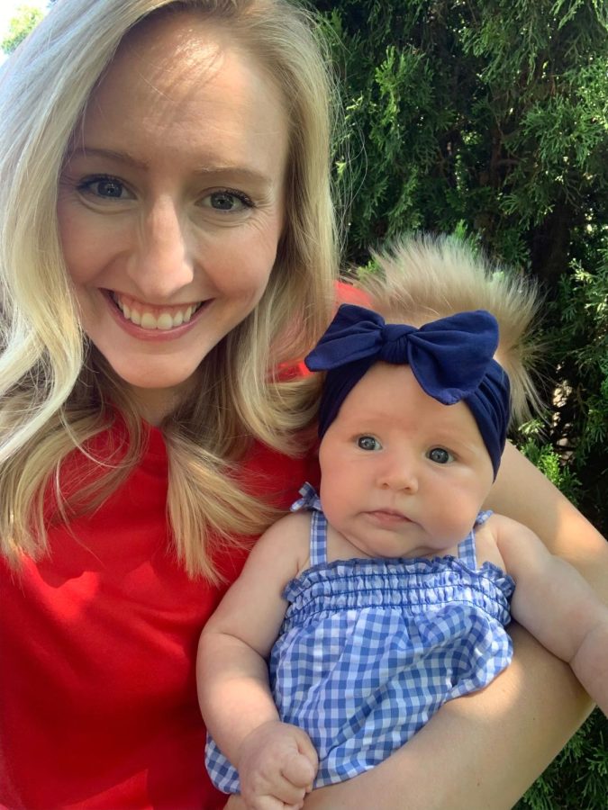 Leslie Heise and her newborn Charlotte enjoy the Fourth of July night. They spent time together with friends and family while at a lake.