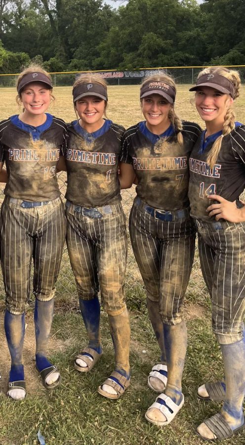 Senior Alyssa Husing, junior Maycee Hays, and seniors Laycee Josoff and Ella Watts pose after a messy game. The girls played a total of 80 games this summer. 
