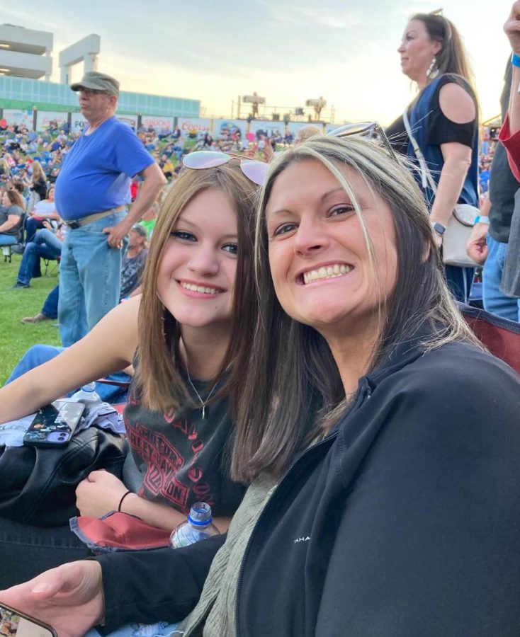 Sophomore Libby Winn and her mom Fallon Winn smile for the camera. The two went to various 80s concerts over the summer.