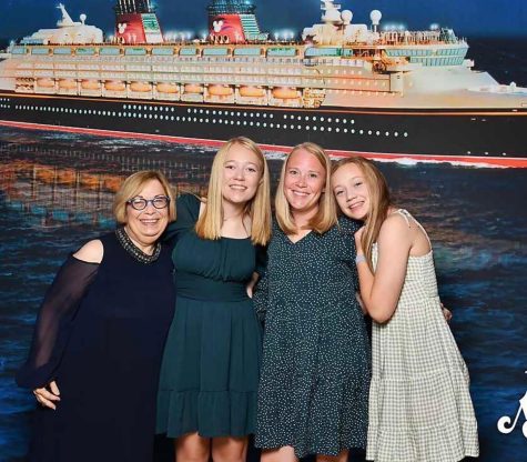 Freshman Kylie Krajicek and her family pose for a picture while on a cruise. Krajicek's family split into two vacations, a girls' vacation and a boys' vacation.