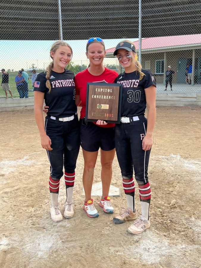 Senior Shaylynn Campbell (right) poses for a picture with her sister, Jordyn, and mom, Brooke, after winning the Capitol Conference championship.