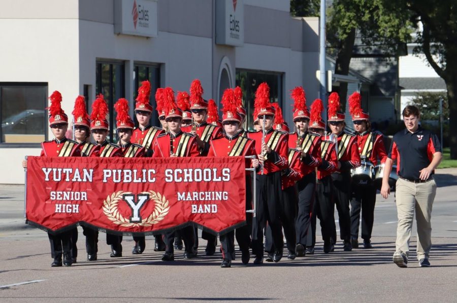 Yutan High School marching band marches through the streets of downtown Columbus. They won first place at Columbus under the direction of Hunter Holoubek. One thing that I did this year was focusing hard on fundamentals and paying close attention to details, Holoubek said. 