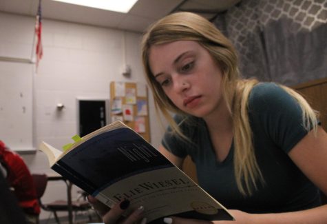 Atlanta Jacobsen reads the book, Night, in Freemans freshman English class. Jacobsen recently made the change from homeschool to public school. 
