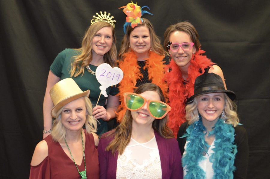Teachers (left to right, back to front) Sarah Portis, Natalie Zabrocki, Ginger Eikmeier, Bethany Clark, Kassie Trevarrow, and Leslie Heise take a photo booth picture at the 2019 prom.  Zabrocki has been a prom and homecoming chaperone every year she has worked at Yutan.