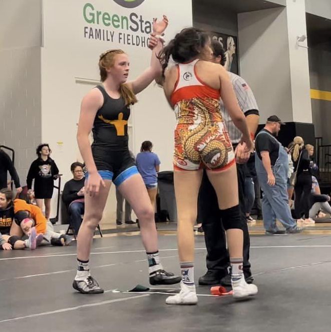 Sophmore Alexis Pehrson wins her finals match at the Mat of Dreams individual tournament. The tournament was held in October in Coralville, Iowa.