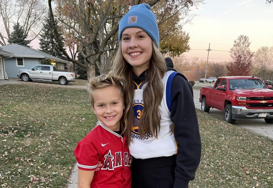 Sophomore Jade Lewis stands with her brother Jaxon in their Halloween costumes. Lewis is one of many sophomores who went trick-or-treating with their younger siblings this year. 