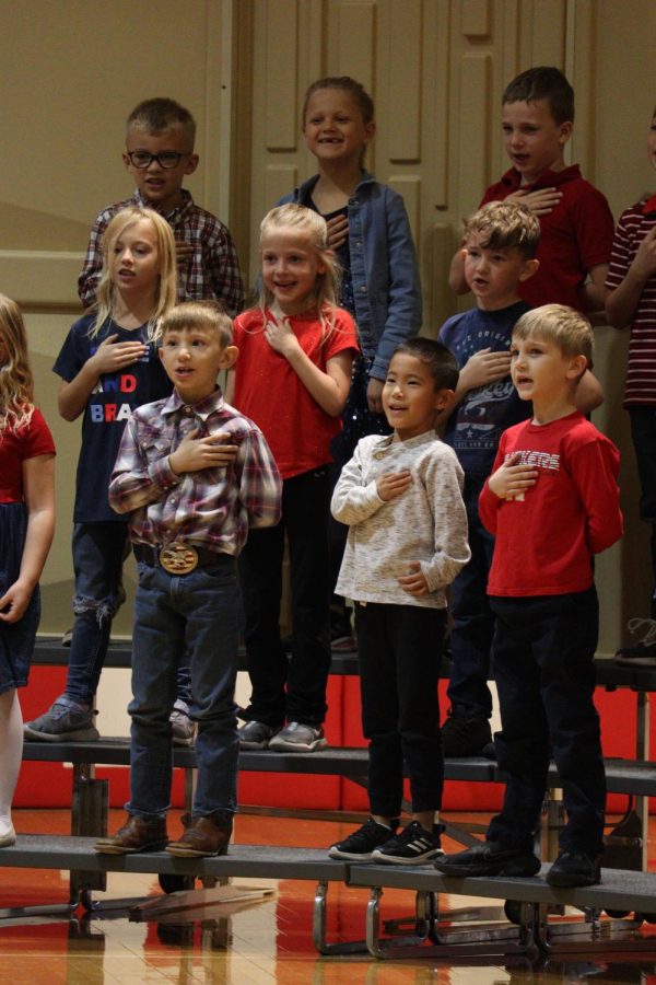 Back row left to right Charlie Baulisch, Sadie Higgins, Callum Suydan, middle row Everley Poole, Baylie Wiebelhaus, Vance Torrey, front row Tyler DiAngelo, Steven Reynolds and Gus Brand performed at the Veterans Day Program. The first graders sang Allegiance Rap to start the Veterans Day program. 