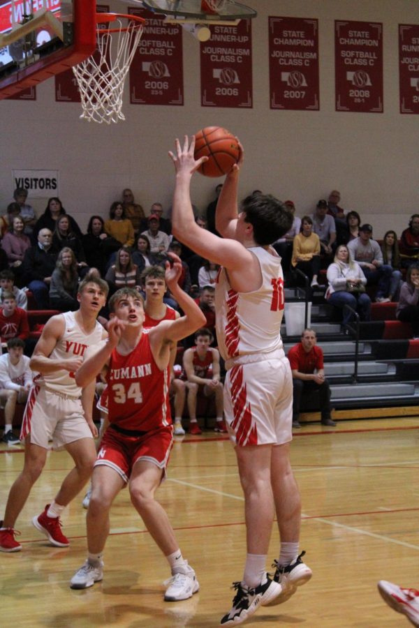 Senior Drake Trent shoots a block shot against Bishop Neumann. Trent has played as long as he can remember. 
