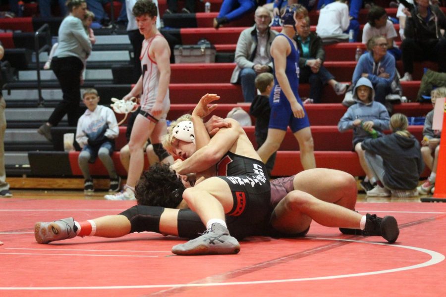 Senior Jett Arensberg pins his opponent at the 2022 Yutan Invite. Arensberg was one match short of making it to state last year.