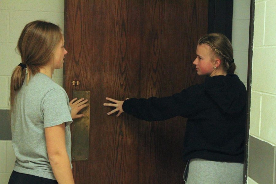 Junior Bella Tederman and freshman Delaney Shield walk into the girls locker room. While many girls still use the locker room, others get ready for sports in other areas of the school. 