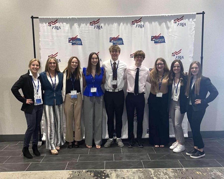 From left to right, Haley Kube, Laycee Josoff, Ellie Lloyd, Maura Tichota, Jack Edwards, Connor Engel, Reagan Wilson, Maycee Hays and Bella Tederman pose for a picture at the 2022 spring FBLA state leadership conference. Tederman won a first place award for Introduction to Business Communication. 