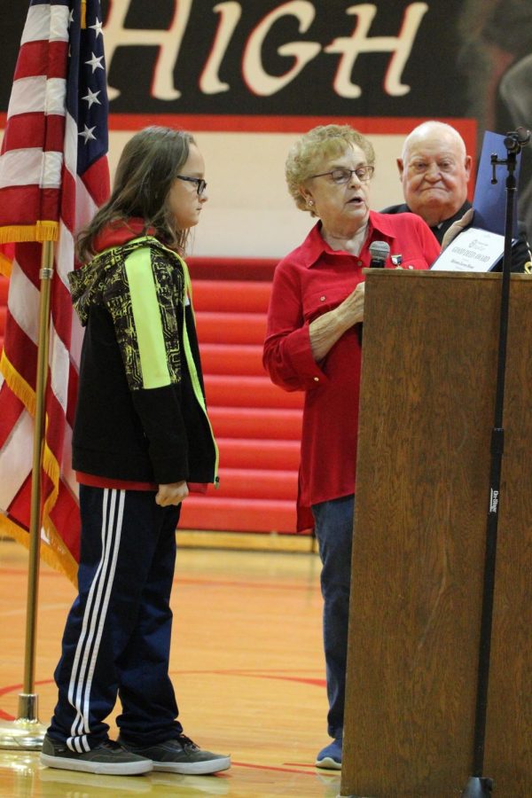 Sixth-grader Rainan Brase is honored with an award from the Ladies Auxiliary.  Brase was selected for his commitment to raising money for Make-A-Wish and Battens disease research.