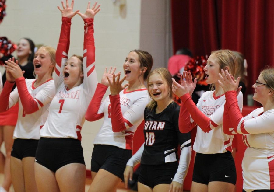 From left to right, Gabi Tederman, Ellie Lloyd, Maura Tichota, Bella Tederman, McKenna Jones and Reagan Wilson cheer during the announcements before a home volleyball game. The team finished the season with a 25-6 record.