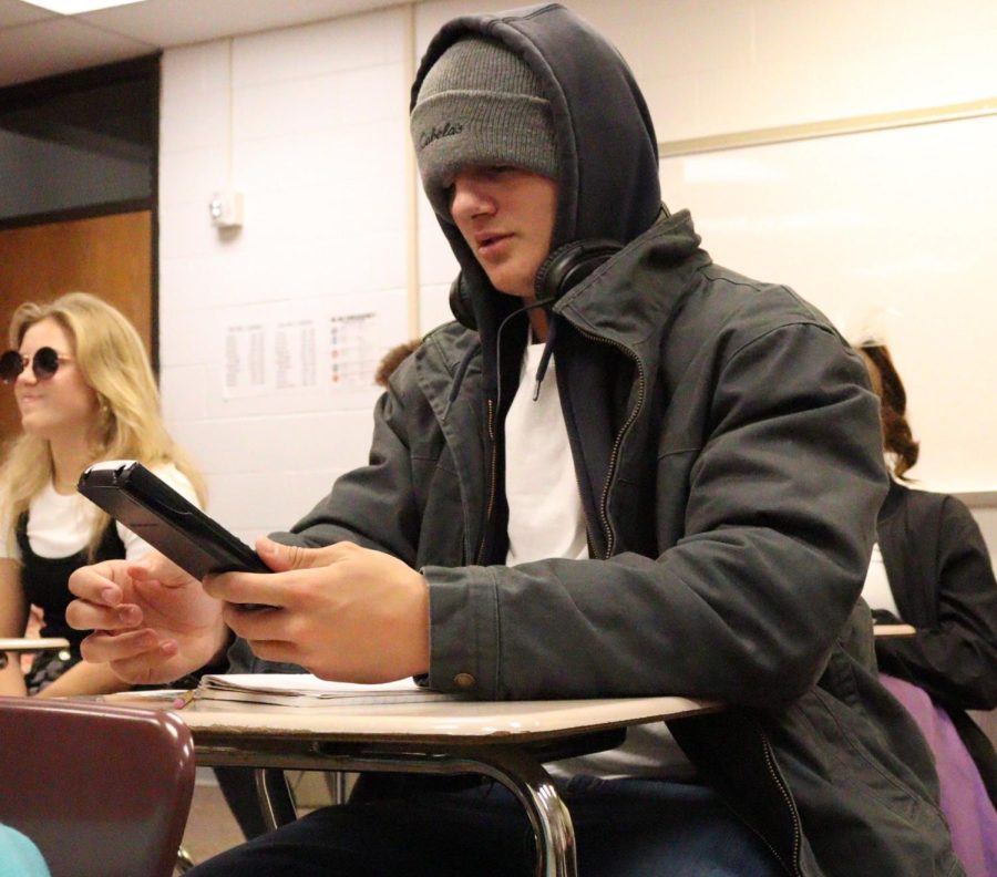 While dressed up as Eminem, junior Derek Wacker works on a math problem. Both Derek and his freshman sister, Nicole, were Eminem for Throwback Thursday. “Well immediately when I think of decades I think of early 2000’s,” said Derek. “Early 2000’s reminded me of the movie ‘8 Mile’ so I thought to dress up as Eminem.”
