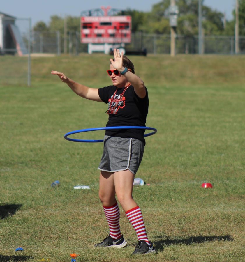 During the teacher vs. seniors minute-to-win-it, math teacher Natalie Zabrocki completes the hula hoop challenge. Zabrocki has been a regular helper and competitor during the annual Chieftain Games.