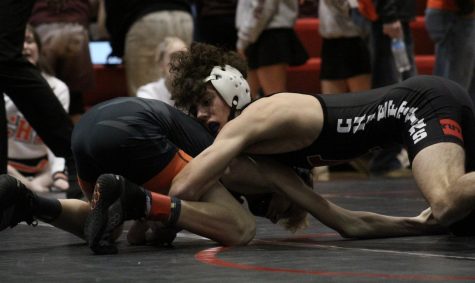 Senior Janson Pilkington looks for a takedown against his opponent at the 2022 Yutan Invite. One of Pilkingtons goals this year is to achieve 100 wins. I got 21 wins away from 100 wins, Pilkington said. 