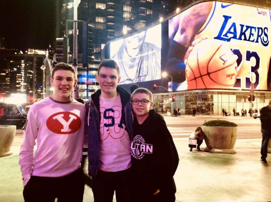 From left to right, brothers Brady, Mason and Nolan Timm pose in front of Los Angeles billboard before a Lakers game. Nolans favorite NBA player at the time was LeBron James.