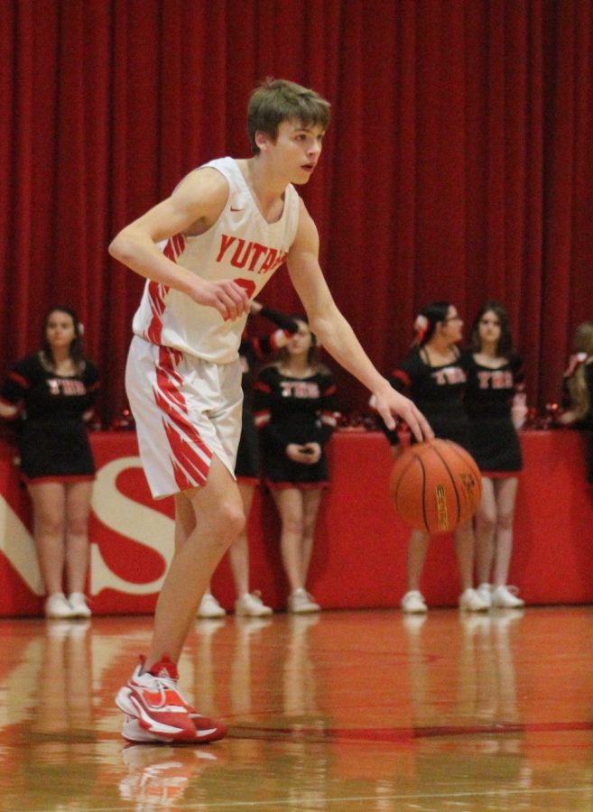 Senior Nolan Timm brings the ball up the floor against Bishop Neumann. Timm scored 109 points last seaon.