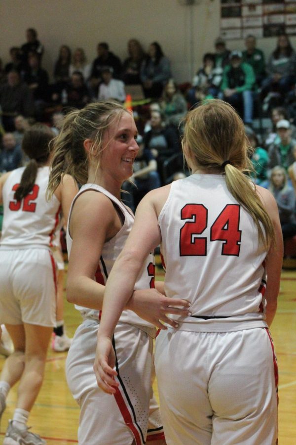 Senior Laycee Josoff talks to junior Ellie Lloyd  after winning their sub district. Josoffs favorite part about basketball is the friends she has made.