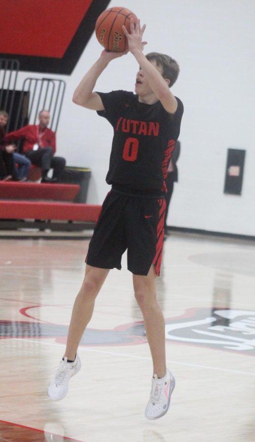 Senior Nolan Timm shoots the ball from the three point line in the West Point-Beemer jamboree. Timm scored 109 points in the 2021-2022 season.