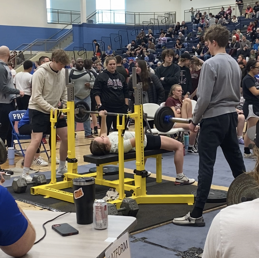 Junior Maycee Hays benches at the raw state meet. Hays plans to continue powerlifting next year.