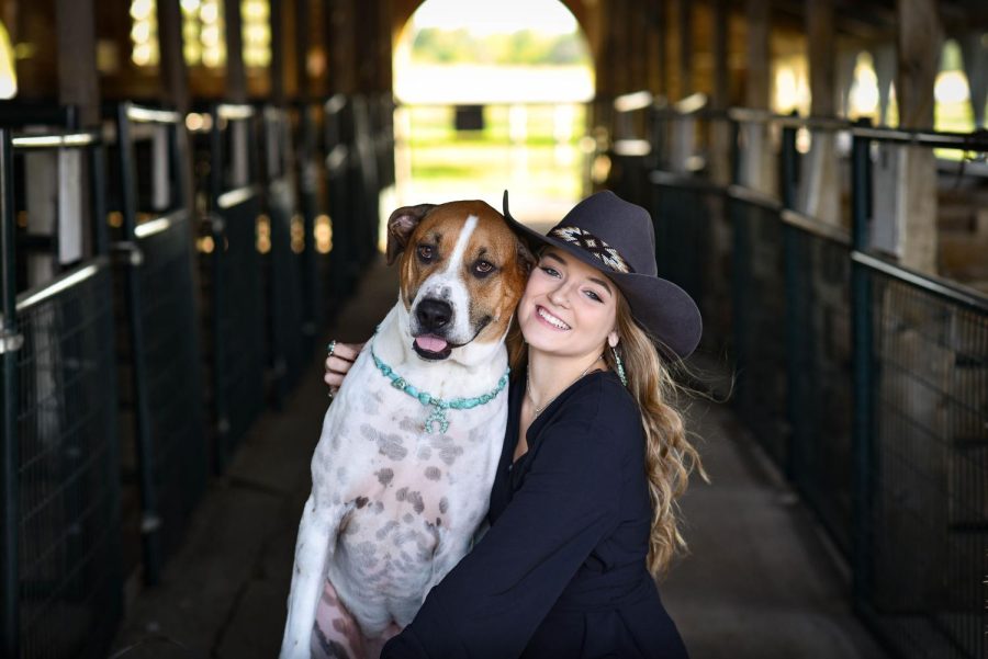 Senior Abby Keiser takes a photo with her dog Ruby. Keiser loves spending as much of her time as possible with Ruby. 