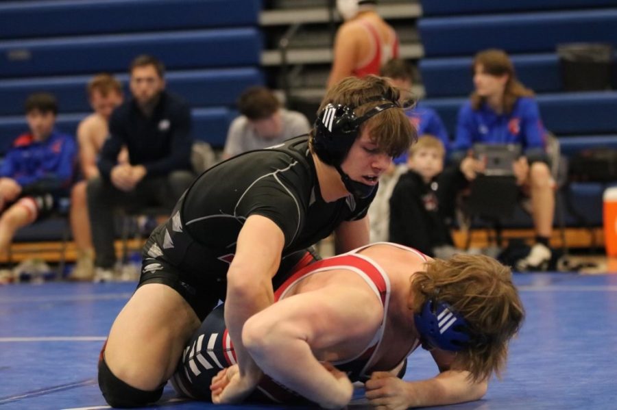 Earning more points, Junior Derek Wacker wrestles his way to beating his Platteview opponent at Ashland-Greenwood. This was Wackers first meet back after his second injury of the season.