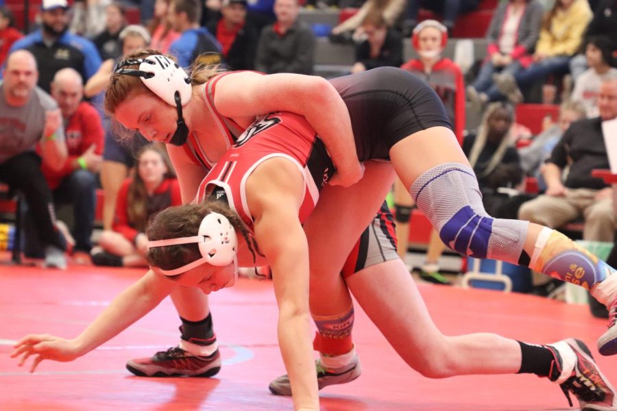 Sophomore Alexis Pehrson gets a takedown on her opponent. Pehrson had the top three ranked wrestlers in her weight class at districts. 