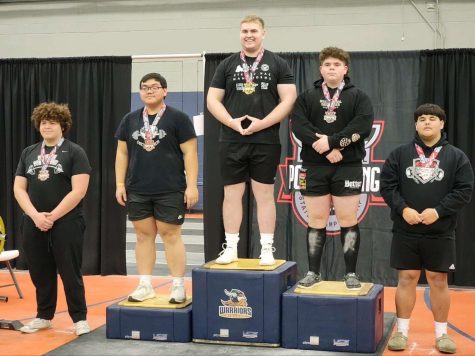 Senior Will Peterson stands atop the podium after securing his second straight state championship. Peterson broke three state records this year.
