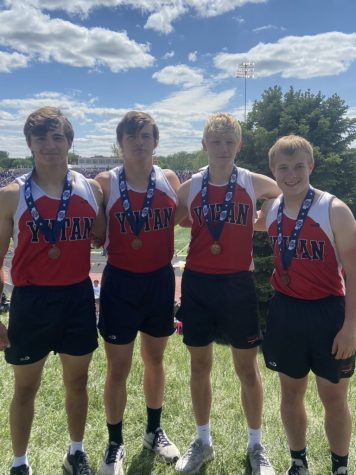 The 2022 4x100 meter relay team including (left to right) graduate Josh Jessen, junior Derek Wacker, senior Jett Arensberg and senior Zach Krajicek poses with their medals. The 4x100 meter relay team placed fifth at the 2022 state meet. 